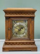 EARLY 20TH CENTURY OAK MANTEL CLOCK, in architectural 'bracket clock' case, with strike/silent and