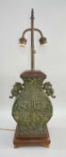 CHINESE SHANG-STYLE BRONZE URN TABLE LAMP, of Hu form, wood base and faded red shade