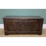 JOINED OAK COFFER, c.1700, moulded plank top above carved frieze and muntins with lozenge panelled