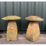 GARDEN ORNAMENTS: comprising two carved limestone staddle stones and caps, 73cm high (2)