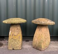 GARDEN ORNAMENTS: comprising two carved limestone staddle stones and caps, 73cm high (2)
