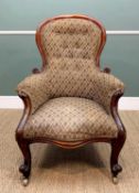 VICTORIAN WALNUT SPOON-BACK ARMCHAIR, with scrolled arms and feet, buttoned trellis pattern