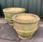 GARDEN ORNAMENTS: comprising two composition stone planters with lateral ribs, larger 68cm diam,