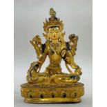SINO-TIBETAN OR NEPALESE GILT BRONZE FIGURE OF GREEN TARA, seated in dhyanasana on lotus pedestal,