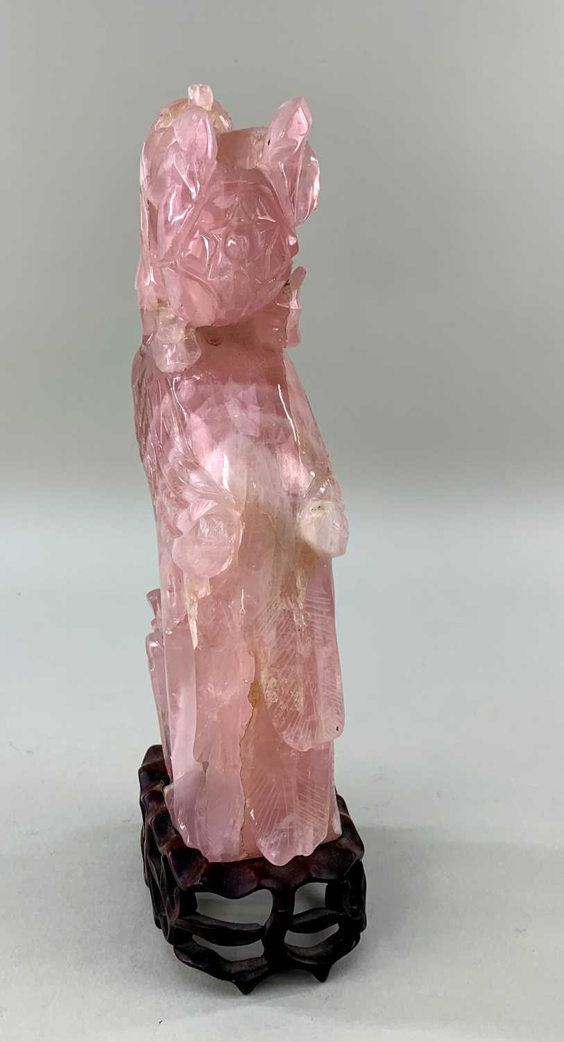 CHINESE ROSE QUARTZ CARVING OF A PHOENIX, with peony branch in its beak, wood stand Comments: - Image 3 of 3