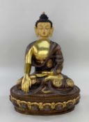 MODERN NEPALESE FIGURE OF SHAKYAMUNI BUDDHA, parcel gilt copper. seated in dhyanasana on a lotus