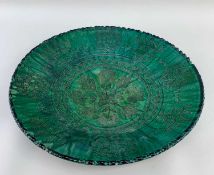 PERSIAN QAJAR-STYLE GREEN GLAZED POTTERY DISH, incised foliate decoration in crosshatching