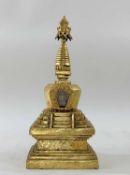 SINO-TIBETAN GILT COPPER STUPA, 19th Century, sealed square-section lotus engraved and double