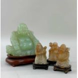 FOUR CHINESE HARDSTONE CARVINGS, 20th Century, comprising bowenite figure of Budai, 11cm h, on