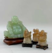 FOUR CHINESE HARDSTONE CARVINGS, 20th Century, comprising bowenite figure of Budai, 11cm h, on