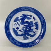 CHINESE BLUE & WHITE PORCELAIN 'DRAGON' DISH, painted in tones of blue with sinuous 4-clawed