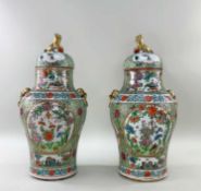 PAIR CHINESE FAMILLE ROSE PORCELAIN BALUSTER VASES & COVERS, 20th Century, decorated with shaped,