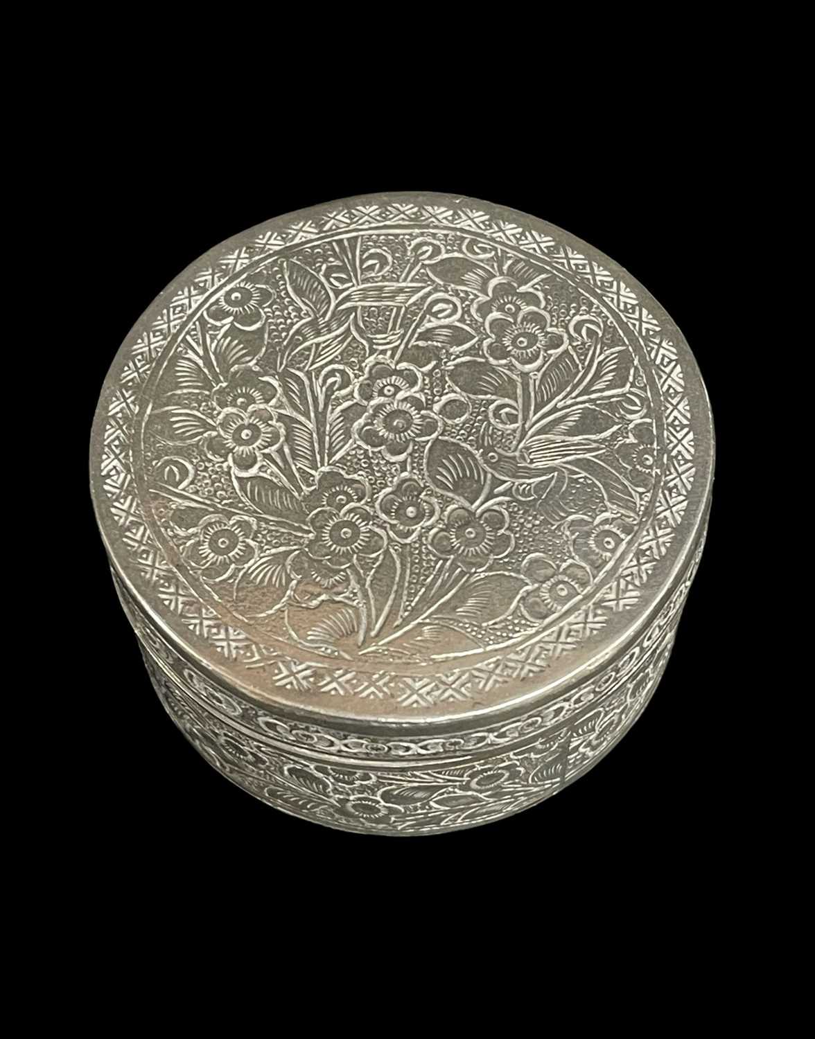 CHINESE WHITE METAL CIRCULAR BOX AND COVER, engraved with birds amongst flowering floiage, 4.8cm