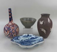 FOUR ASIAN CERAMICS, including Japanese Arita blue and white dish painted with a landscape, base