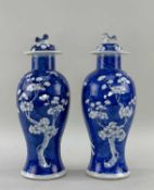 PAIR CHINESE BLUE & WHITE PORCELAIN VASES & COVERS, late Qing dynasty or later, each painted with