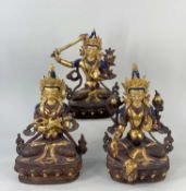 THREE MODERN NEPALESE FIGURES OF BODHISATTVAS, parcel gilt copper, including Green Tara seated, 21cm