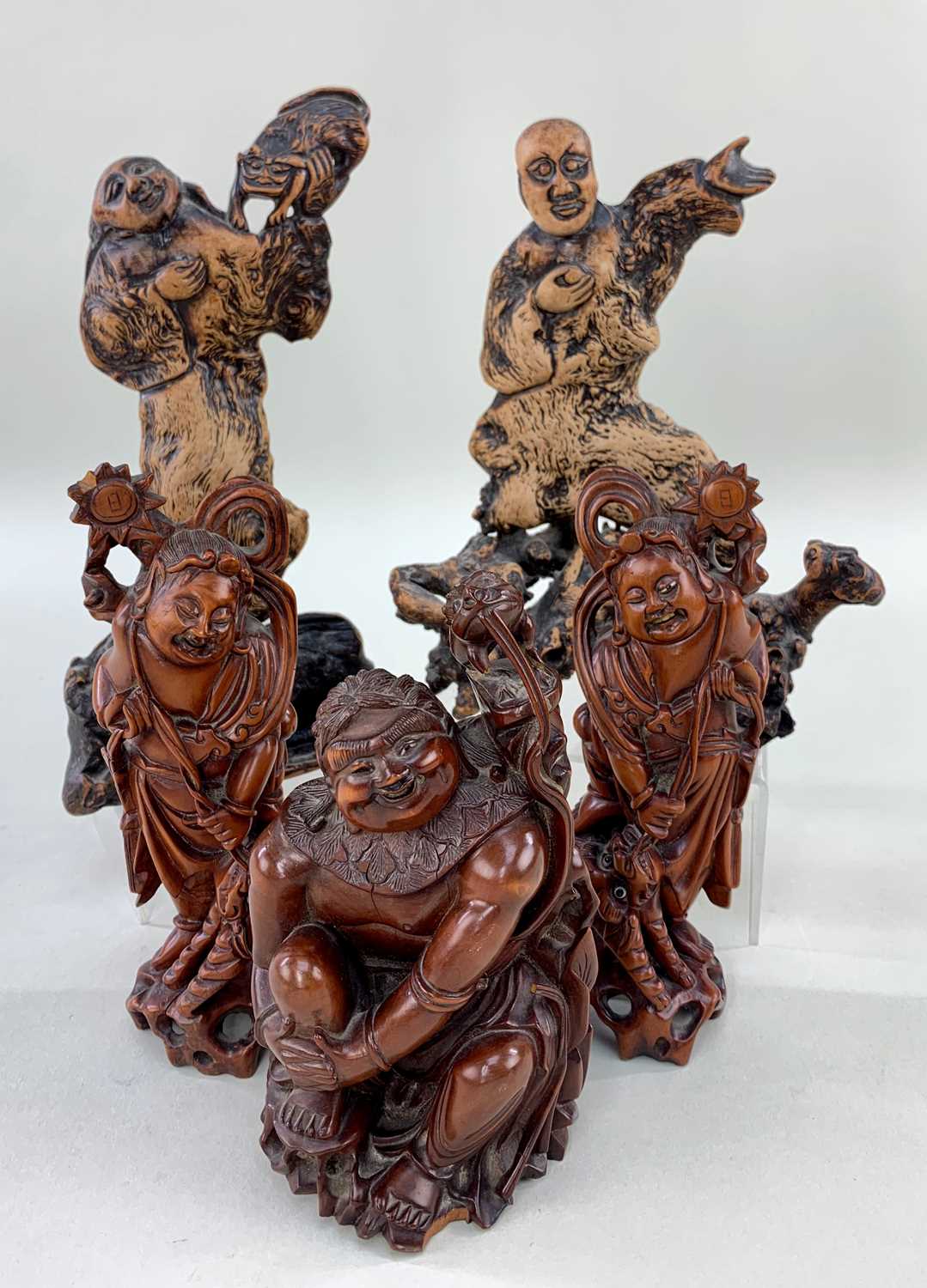 FIVE CHINESE WOOD CARVINGS, comprising boxwood figure of Liu Hai seated on rock with the three