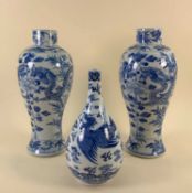 THREE CHINESE BLUE & WHITE PORCELAIN VASES, comprising pair baluster vases painted with 4-clawed