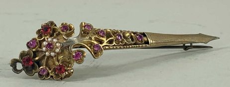 SRI LANKAN KONDAKOORA PIN, silver gilt and set with mine-cut rubies, seed pearls and other stones,