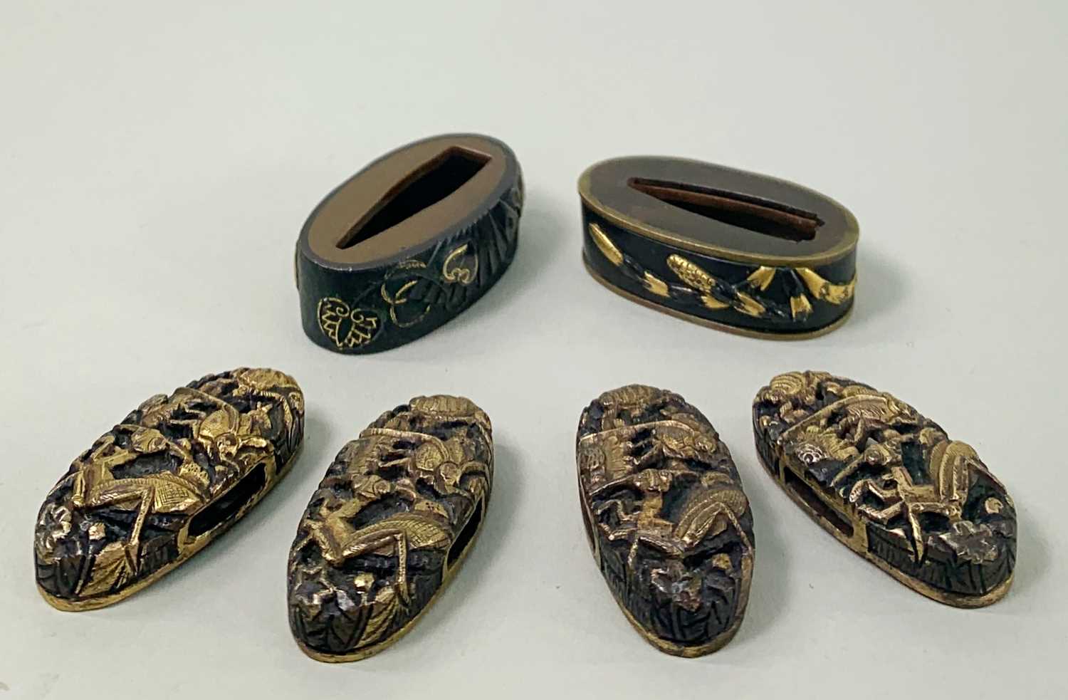 GROUP OF SIX JAPANESE SHAKUDO FUCHI KASHIRA, Edo Period, comprising two fuchi decorated with
