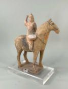 CHINESE GREY POTTERY MODEL OF A HORSE & RIDER, Tang Dynasty style, the rider with raised hand and
