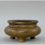 CHINESE BRONZE CENSER, Qing dynasty or later, bombe form with everted rim, and three short feet,