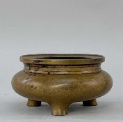 CHINESE BRONZE CENSER, Qing dynasty or later, bombe form with everted rim, and three short feet,