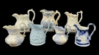 SEVEN VARIOUS WELSH JUGS WITH MOULDED DECORATION including Llanelly, three Ynysmeudwy,
