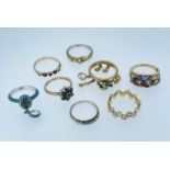EIGHT ASSORTED RINGS comprising five 9ct gold rings set with various gems including diamonds,
