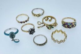 EIGHT ASSORTED RINGS comprising five 9ct gold rings set with various gems including diamonds,