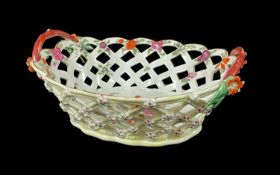 WORCESTER PORCELAIN OVAL BASKET, c. 1768-1772, yellow ground exterior applied with pink and green