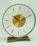JAEGER LECOULTRE 'MYSTERY' CLOCK, circular perspex dial, baton numerals, gilt base, 15cm h Comments:
