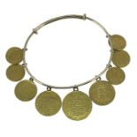 YELLOW METAL NINE COIN EXPANDING BRACELET set with George IV gold sovereign, shield reverse, 1825,