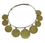 YELLOW METAL NINE COIN EXPANDING BRACELET set with George IV gold sovereign, shield reverse, 1825,