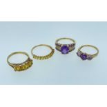 FOUR 9CT CITRINE OR AMETHYST RINGS, including a five-stone citrine and a facet cut oval amethyst