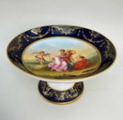 VIENNA-STYLE PORCELAIN COMPORT, c. 1900, centre painted with classical figures entitled 'Amor und