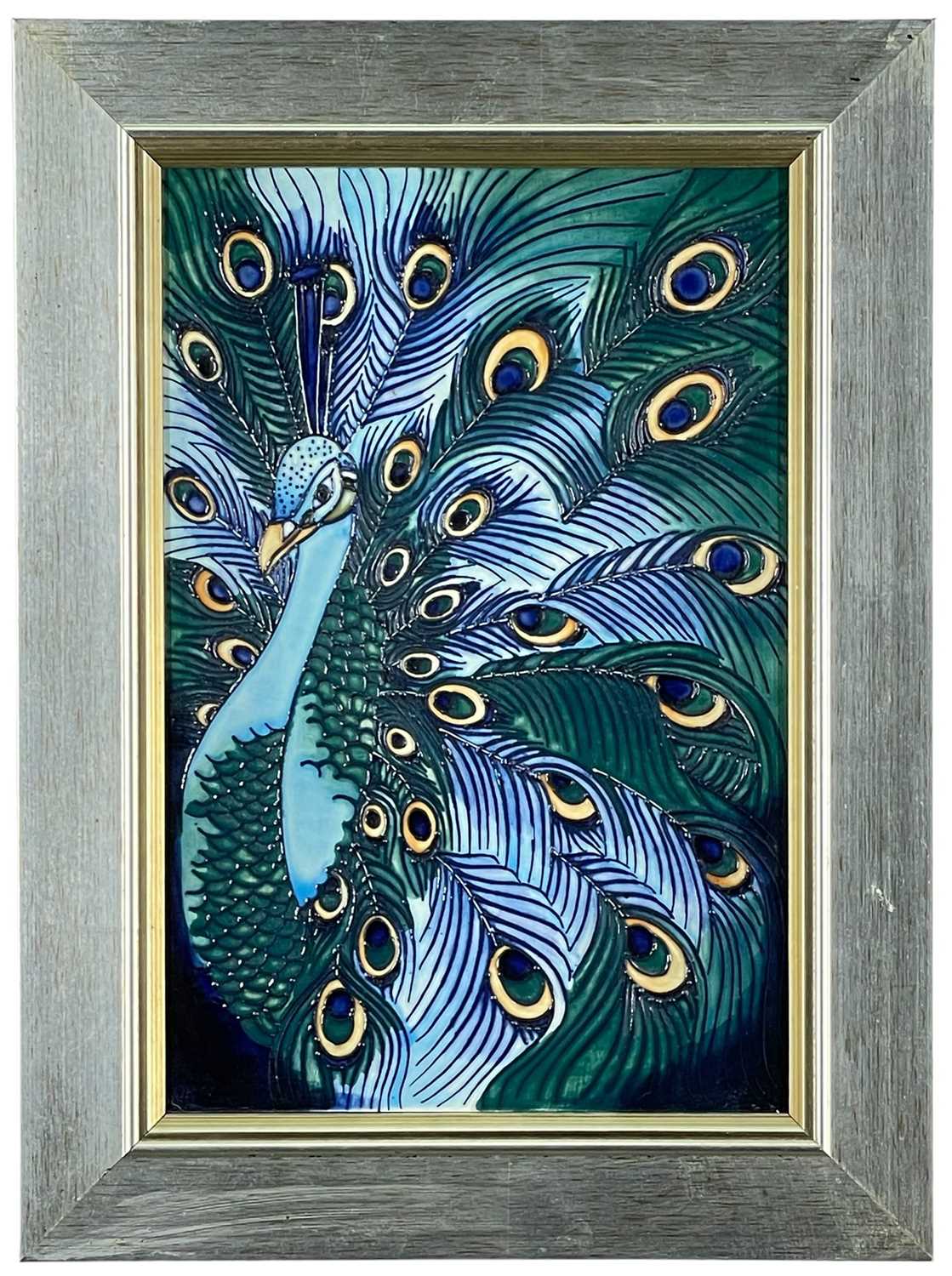 MODERN MOORCROFT POTTERY TUBE LINED PLAQUE, of a displaying peacock by Rachel Bishop, limited