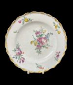 BOW PORCELAIN TEA PLATE, c. 1765, with gilt scalloped rim, decorated with sprays and sprigs of