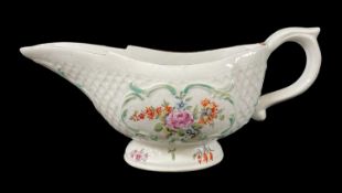 DERBY PORCELAIN OVAL SAUCE BOAT, c. 1765, moulded with an overlapping leaves and reserved with