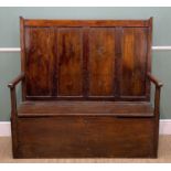 EARLY 19TH CENTURY OAK BOX SETTLE, with four panelled back and hinged seat, 132w x 47d x 130cms h