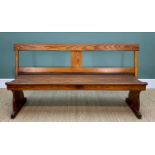 PITCH PINE TRAM BENCH or CHAPEL PEW, with swing back and double-plank seat, trestle ends, 160cm L