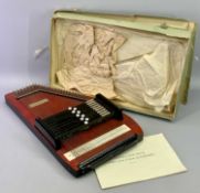 A 9 BAR AUTOHARP - in red and black lacquered case boxed with instructions