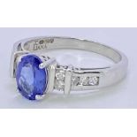 18CT WHITE GOLD & POSSIBLY BLUE TANZANITE & DIAMOND RING - approx 1ct oval facet cut central