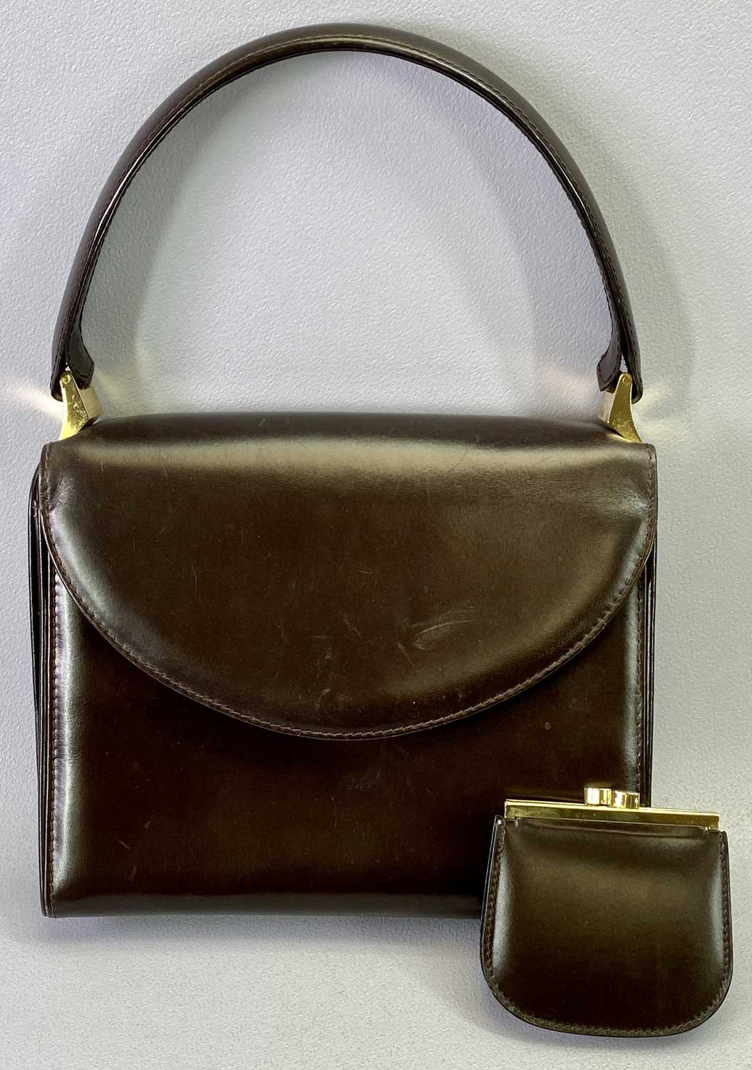 A GUCCI VINTAGE BROWN LEATHER HANDBAG with loop handle, gilt brass fittings, stamped inside 'Made in