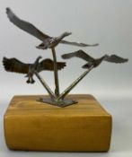 WOOD MOUNTED SCULPTURE OF THREE GEESE TAKING FLIGHT - marked to the storks 'Nubey sterling', 25.5cms