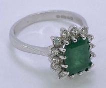 18CT WHITE GOLD EMERALD & DIAMOND RING - baguette cut emerald, slightly over 1.5cts, surrounded by