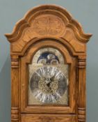 MODERN OAK LONGCASE CLOCK - with movement by Kieninger and labelled Howard Miller, with rolling moon
