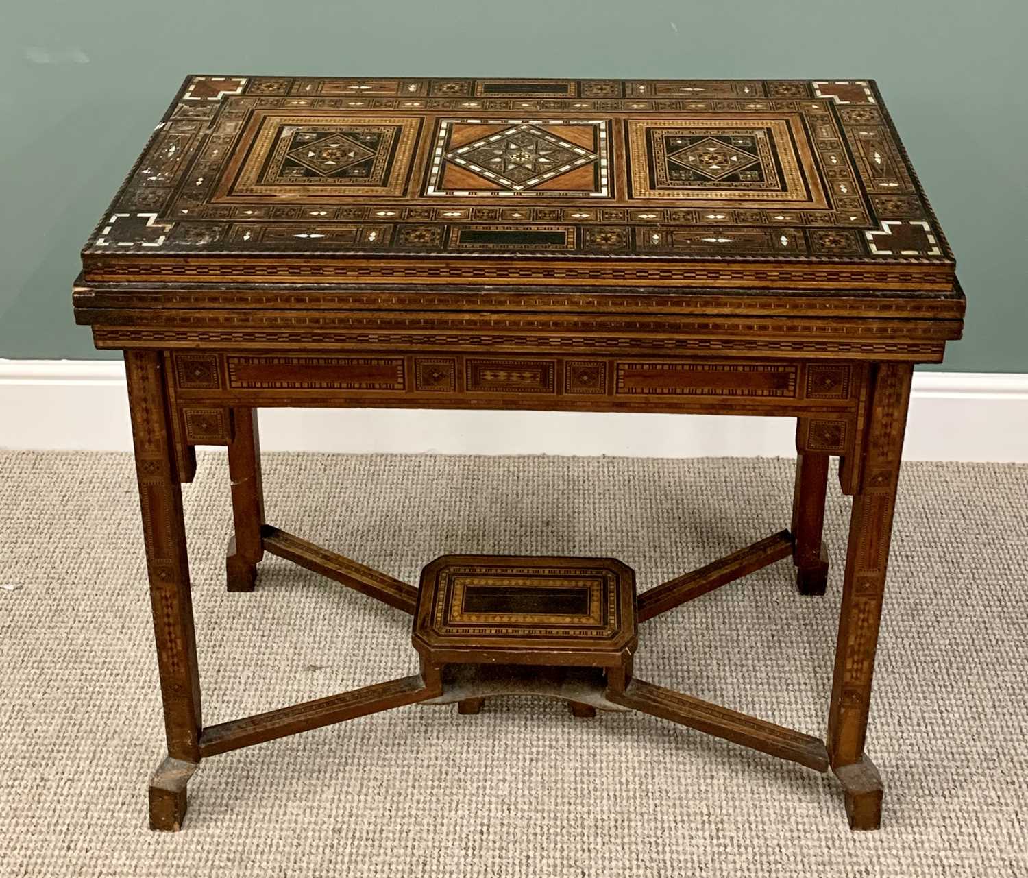 PARQUETRY & MOTHER OF PEARL INLAID GAMES TABLE- probably Syria early 19th Century having a fold-