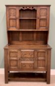 CIRCA 1900 OAK DRESSER - the rack with two cupboard doors and two central shelves, the base having
