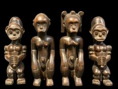 FOUR SMALL FANG FIGURES, carved as reliquary guardians, 24cm h (4)